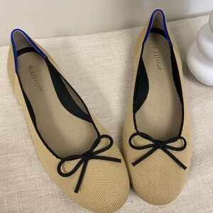 Rothy's Beige Flats with Black Bow and Blue Trim